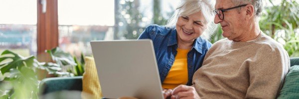 A mature couple looking at retirement interest only options against equity release