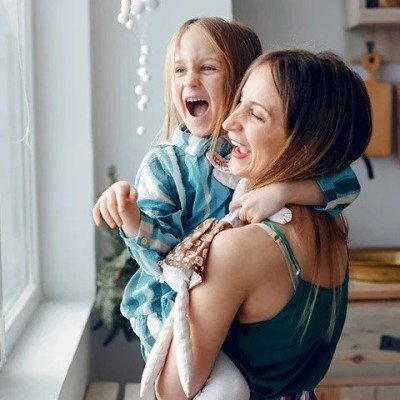 Mother smiling with daughter after receiving Expat residential mortgage help from the Marsden Intermediaries 