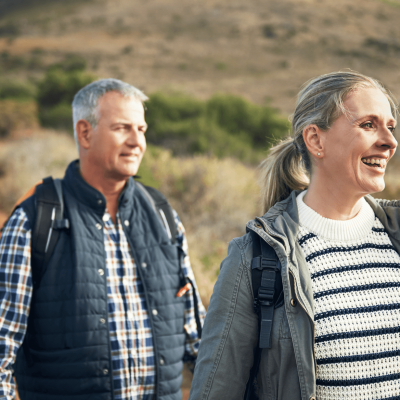 Couple approaching retirement enjoy a walk in the countryside after securing a Lending into Retirement mortgage with Marsden Building Society