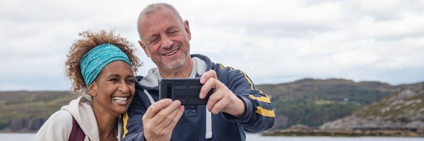 Couple talking a selfie outdoors | Furnished Holiday Let mortgage case study