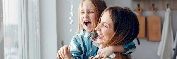 Mother smiling with daughter after receiving Expat residential mortgage help from the Marsden Intermediaries 