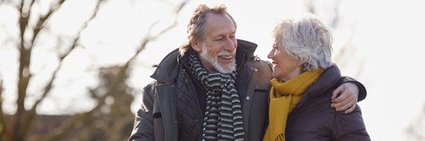 Older couple enjoying a winter walk | Retirement Interest Only (RIO) case study