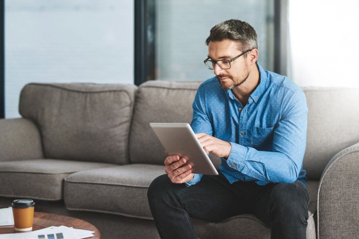 Man sits in his home after applying for a Residential mortgage with the Marsden, on behalf of his client.