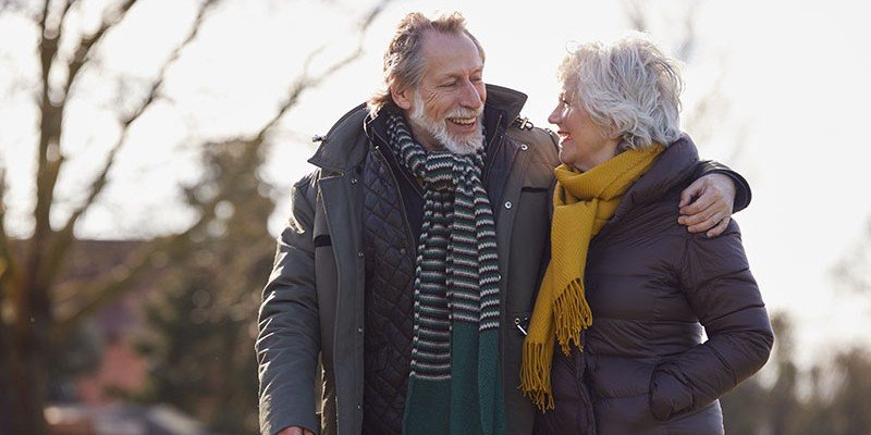 Older couple enjoying a winter walk | Retirement Interest Only (RIO) case study
